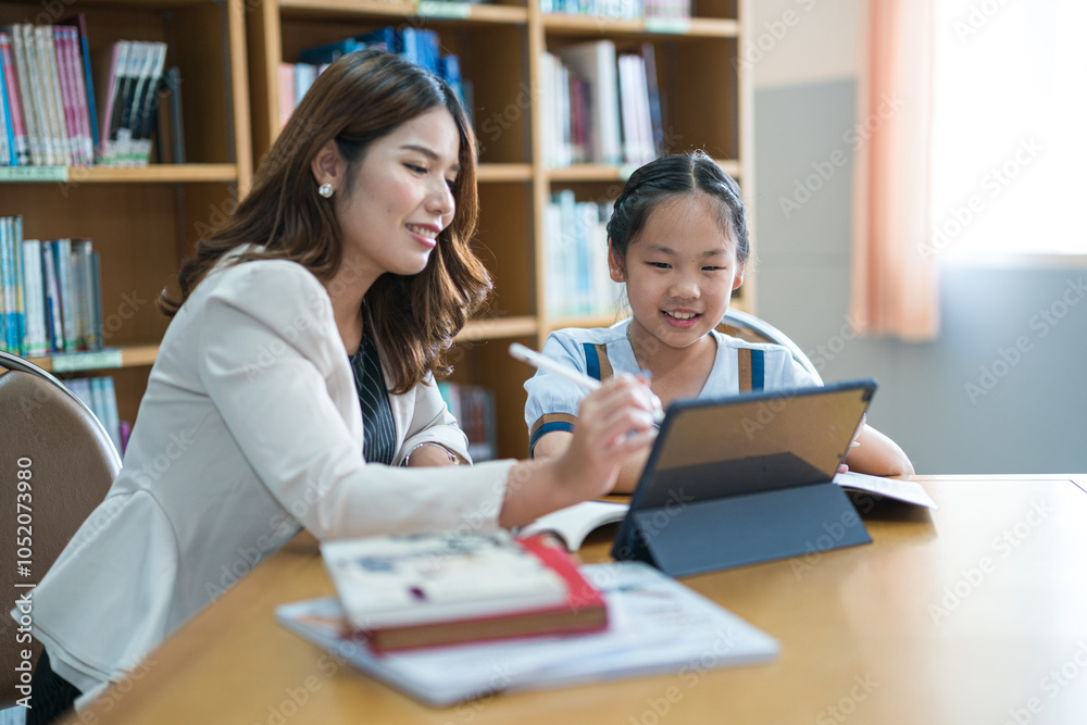 A young student studies with a private tutor in home office setting, focusing on personalized learning and academic development. A young student studies with a private tutor in home office setting, focusing on personalized learning and academic development.