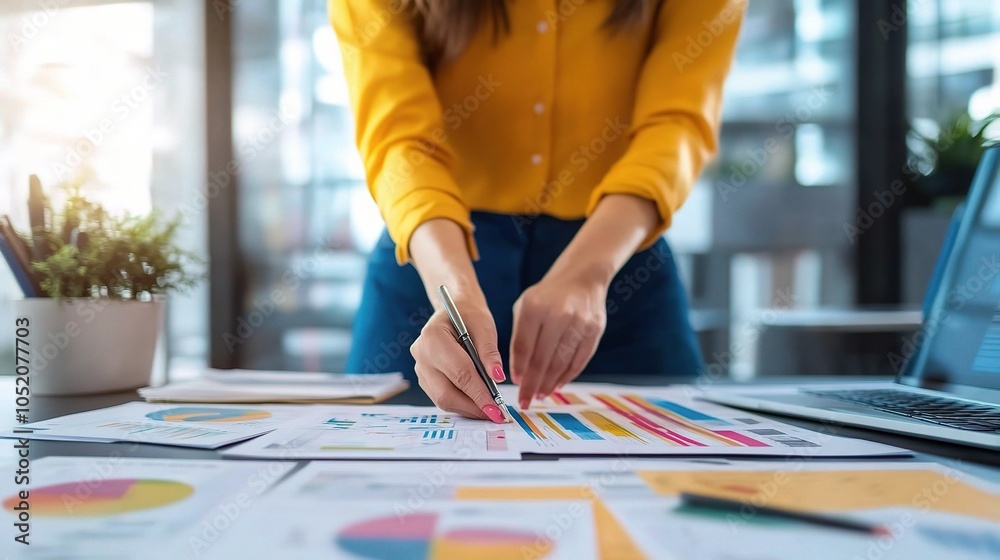 Businesswoman Analyzing Data with Charts and Graphs Businesswoman Analyzing Data with Charts and Graphs