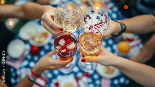 Friends toasting at a festive outdoor summer picnic.