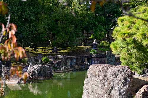 The Japanese gardern view of nijo jo castle, Kyoto, Japan. World Heritage Site, Japanese old traditional architecture in Kyoto, Japan. Background landscape of the beauty of Nijo Castle at sunny day. photo