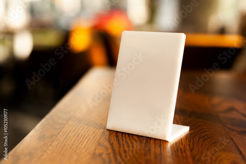 the order number on the table on the street in a McDonald's restaurant. Awaiting an order at a McDonald's restaurant. Fast food with invoice, check.