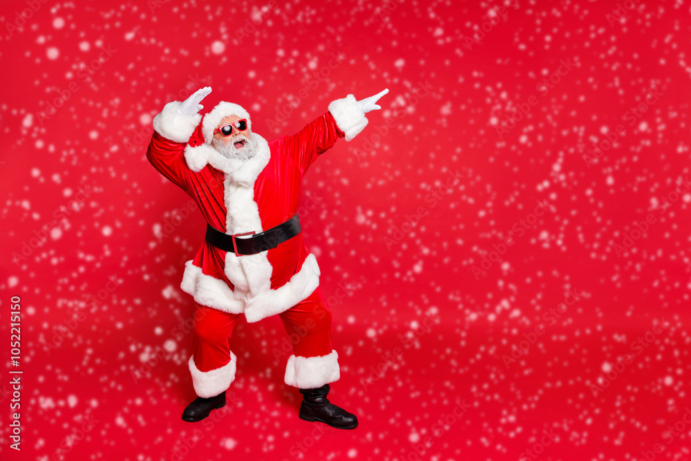 Full length body size view of his he nice attractive cheerful cheery careless bearded Santa having fun rejoicing fairy eve noel isolated over bright vivid shine red background