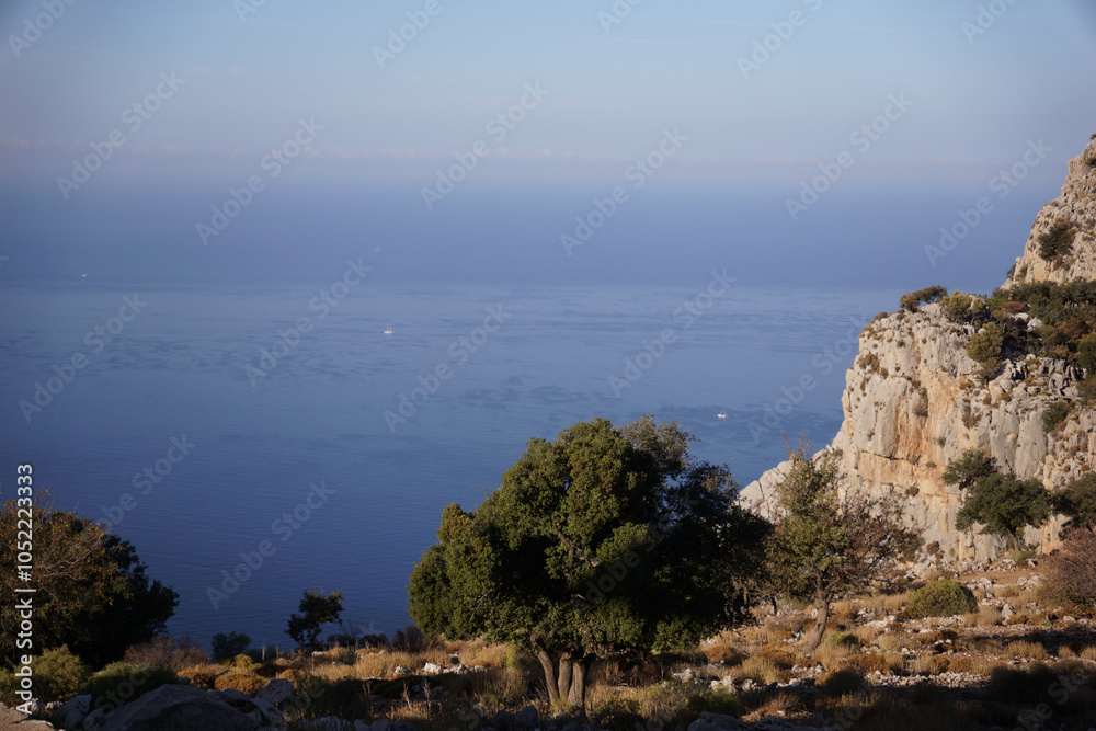 view from the top of the mountain to the cliff and the sea view from the top of the mountain to the cliff and the sea