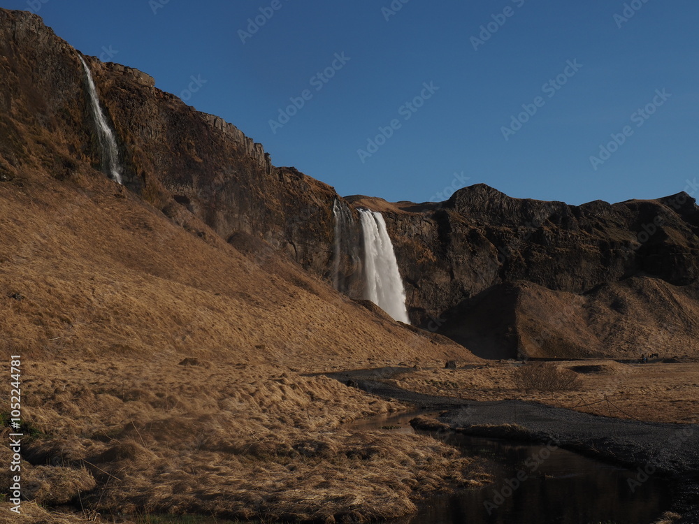 Fototapeta premium Waterfall on rocks - Iceland