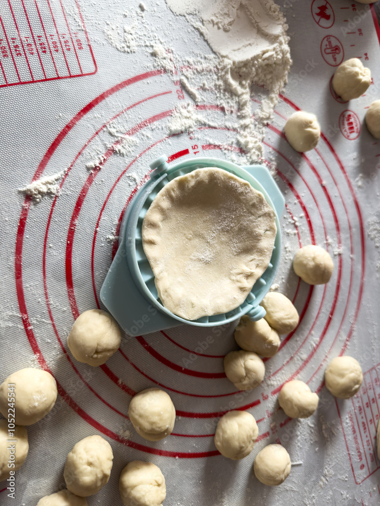 raw dough balls for dumplings kluski slaskie on flour on kitchen desk