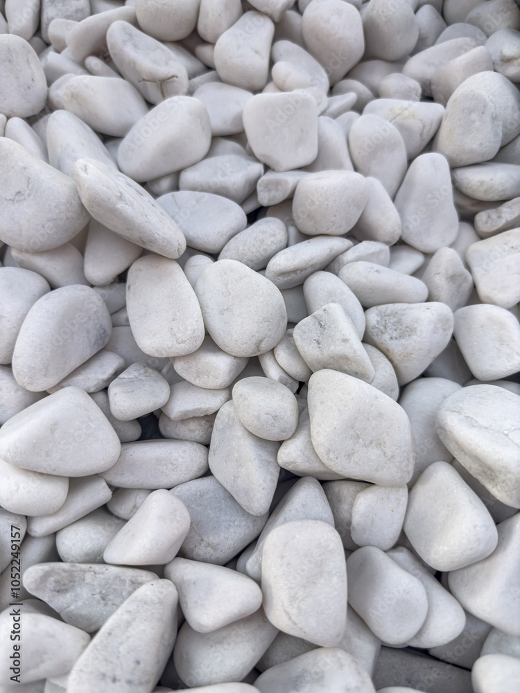 a white small pebbles stone as background rock texture a white small pebbles stone as background rock texture