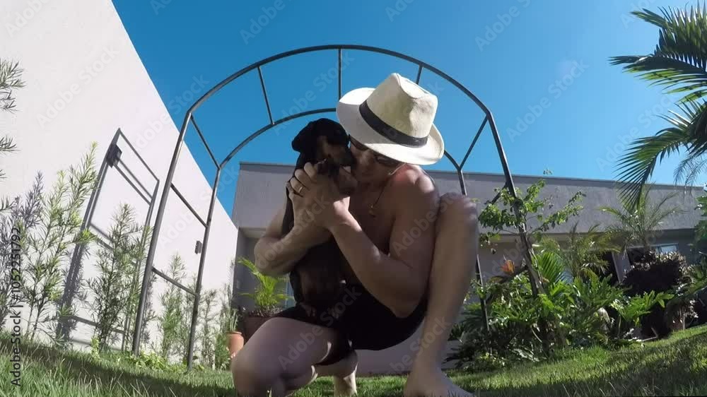 homem da carinho em cachorro doméstico 