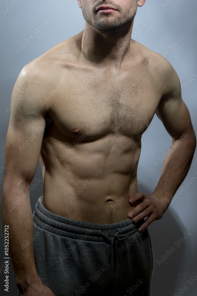 Naklejka premium A young shirtless muscluar man
