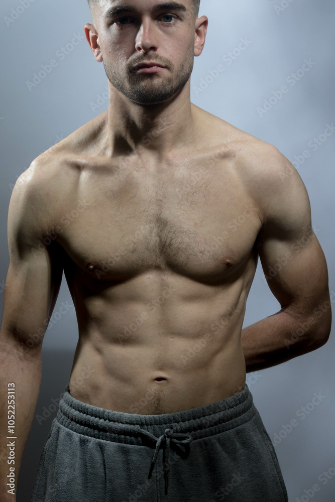 Fototapeta premium A young shirtless muscluar man