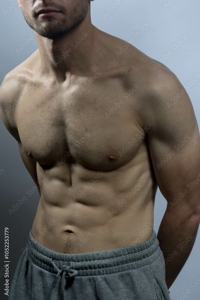 Obraz premium A young shirtless muscluar man