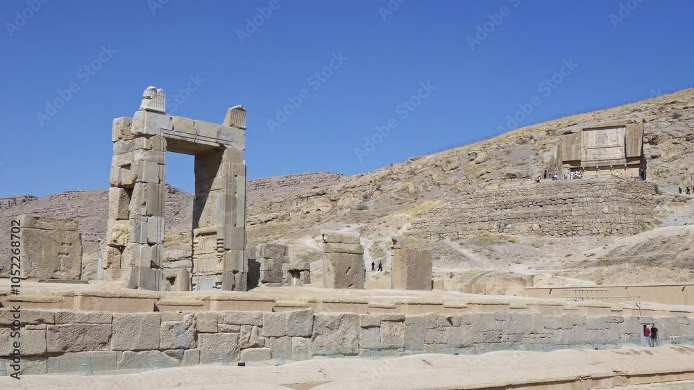 A majestic stone archway in a vast desert, Ancient Persepolis, Iran A majestic stone archway in a vast desert, Ancient Persepolis, Iran
