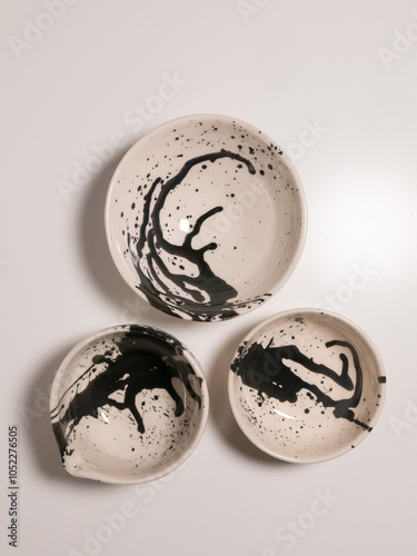 White and black ceramic plates on white background