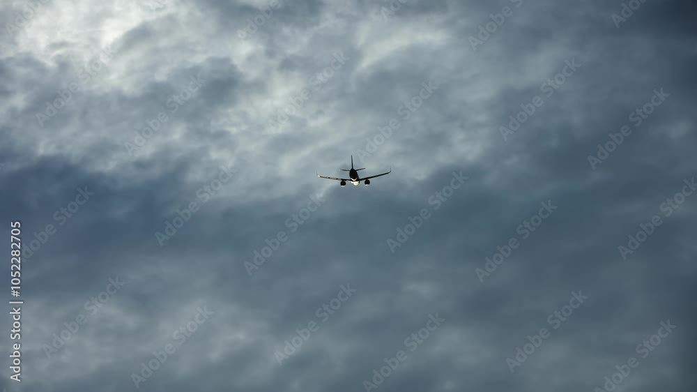 The plane flies in the cloudy sky. Concept of travel and air travel. The plane flies in the cloudy sky. Concept of travel and air travel.
