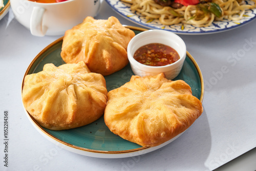 Fried buns stuffed with meat Delicious meat pies belyashi on a background