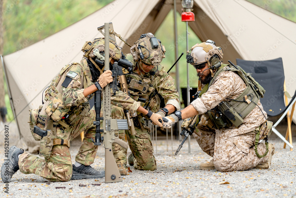 Group of militaries or soldiers stay in front of tent also do first bump during outdoor practice. Group of militaries or soldiers stay in front of tent also do first bump during outdoor practice.