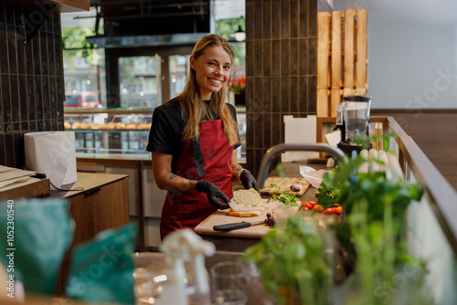 Photography A cheerful and enthusiastic chef is busy slicing a variety of fresh and colorful