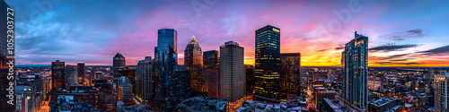 North Carolina. A city skyline at sunset with the sun setting behind the buildings