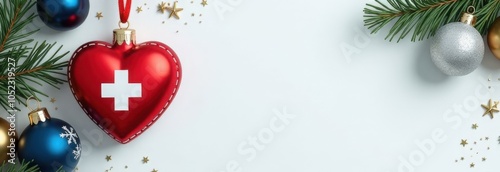 Heart-shaped Christmas ornament with medical cross on a white background. Medicine, healthcare, cardiology concept. Design for greeting card, invitation, poster, banner. Copy space