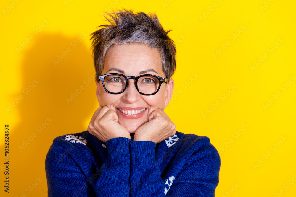 Photo of cute lovely senior woman wear blue trendy clothes isolated on yellow vivid background Photo of cute lovely senior woman wear blue trendy clothes isolated on yellow vivid background