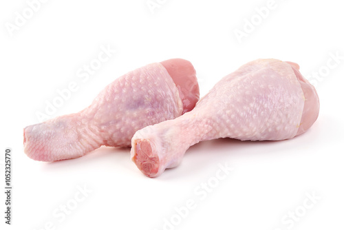 Raw chicken drumsticks isolated on white background.