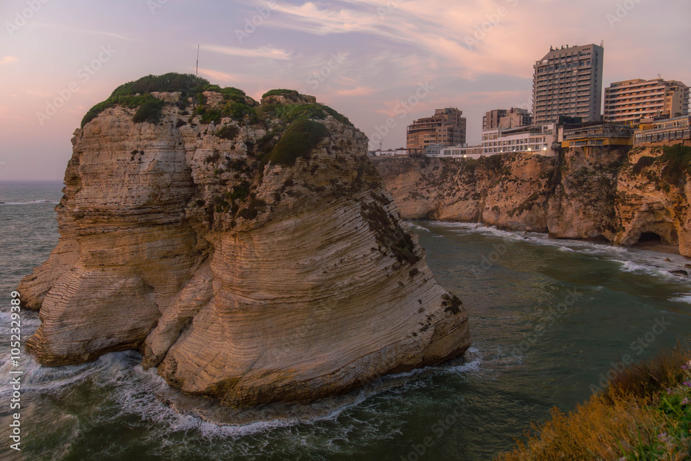 Obraz premium Beirut city with famous Pigeons' Rock (Raouche rocks) on the Mediterranean sea coastline with modern architecture in Lebanon. 