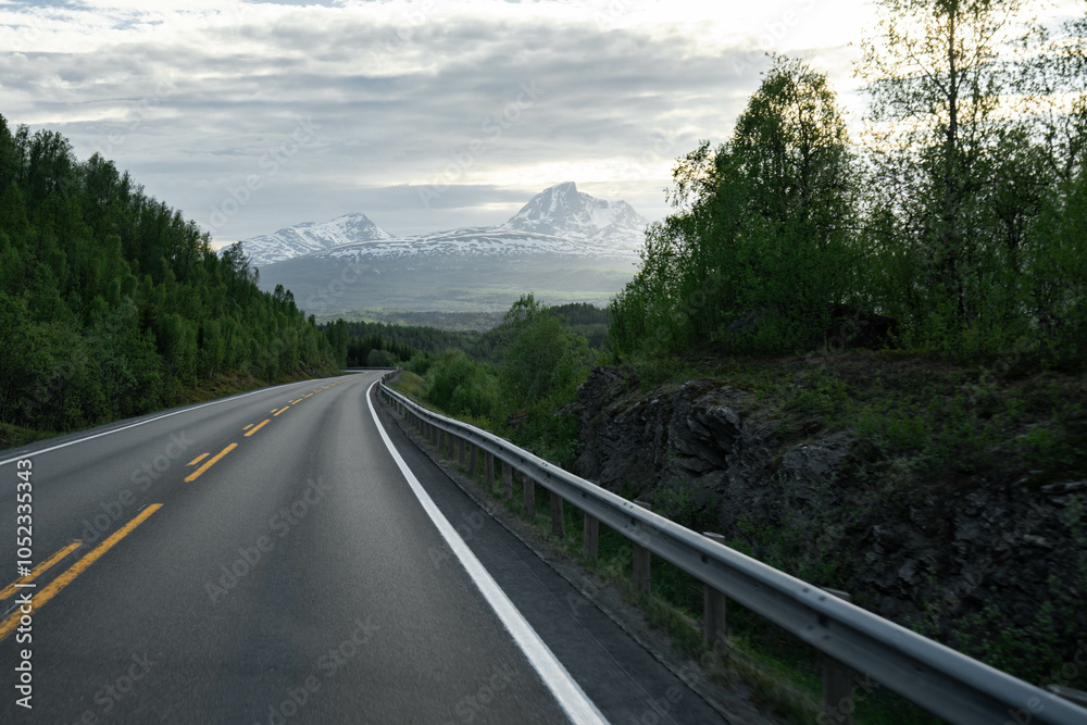 Empty road in a moody norway mountain landscape Empty road in a moody norway mountain landscape