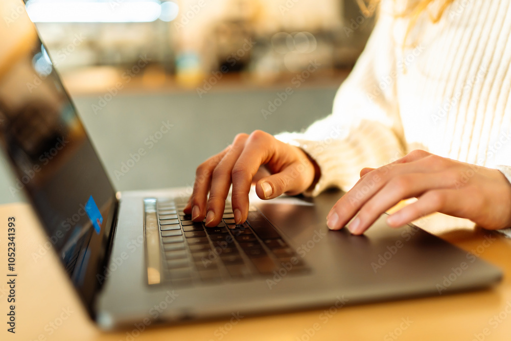 Close-up of hands working on a laptop keyboard. Business, Freelance, Shopping, education. Close-up of hands working on a laptop keyboard. Business, Freelance, Shopping, education.