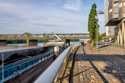 Frankfurt, Germany - July 29, 2024: A coal barge offloading along the shores in Frankfurt
 photo