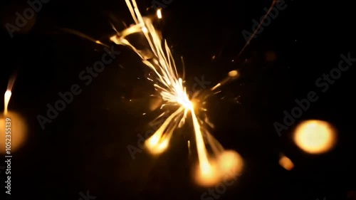 Dynamic radiant spark flutter on black background