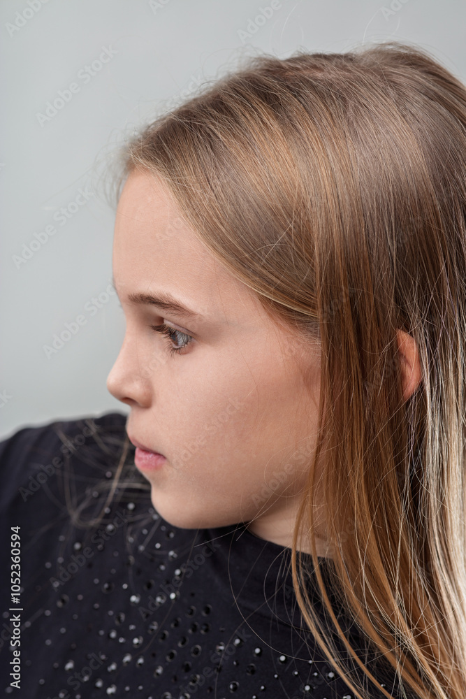 Young girl showing emotion with thoughtful expression in profile Young girl showing emotion with thoughtful expression in profile