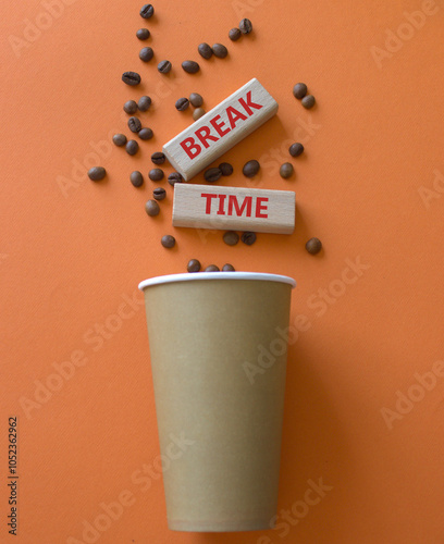 Break Time symbol. Concept word Break Time on wooden blocks. Beautiful orange background with coffee cup. Business and Break Time concept. Copy space #1052362962