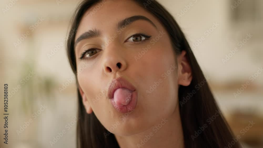 Happy smiling positive funny playful Arabian woman Indian girl female Hispanic lady smiling attractive pretty at home indoors playing grimace showing tongue having fun joyful humorous grimacing face Happy smiling positive funny playful Arabian woman Indian girl female Hispanic lady smiling attractive pretty at home indoors playing grimace showing tongue having fun joyful humorous grimacing face