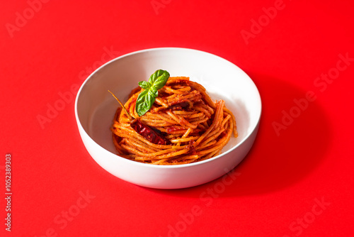 Spaghetti all'assassina is a typical Apulian recipe, Bari. Trendy first course, pasta cooked directly in a pan with tomato sauce, crunchy and spicy flavor. Red bloody color
