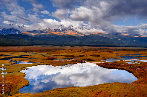 Beautiful landscape crystal clear mountain lake with sky reflection, autumn Altai photo