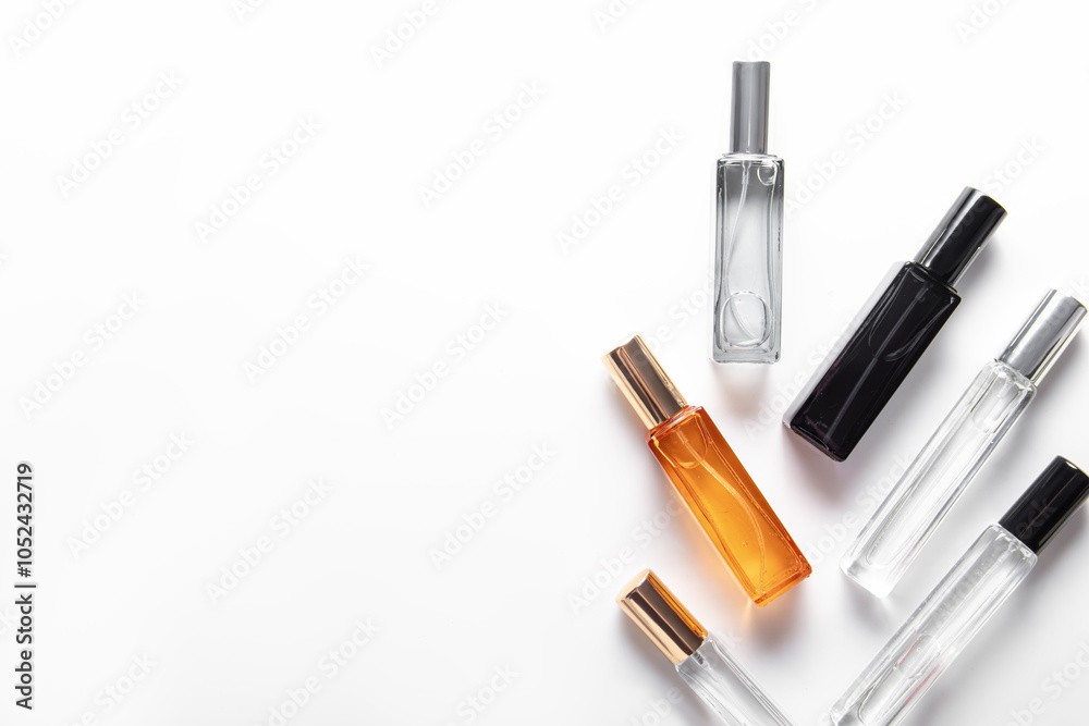 Different perfume bottles on white background. Free space for text Different perfume bottles on white background. Free space for text