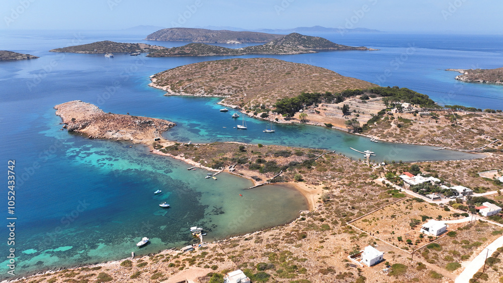 Aerial drone photo of paradise island with crystal clear turquoise beaches and main seaside town of Arki or Arkoi, Dodecanese, Greece