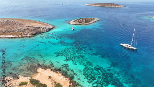 Aerial drone photo of paradise blue lagoon and sandy beaches of Tiganakia bay forming a complex of small islets in island of Arkoi or Arki, Dodecanese, Greece photo