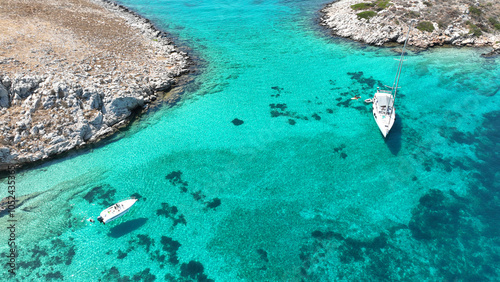 Aerial drone photo of paradise blue lagoon and sandy beaches of Tiganakia bay forming a complex of small islets in island of Arkoi or Arki, Dodecanese, Greece photo