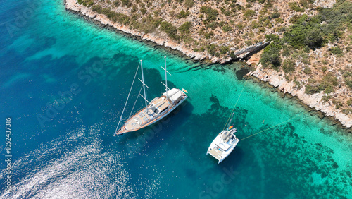 Obraz na płótnie Aerial drone top down photo with copy space of luxury yacht anchored in tropical exotic island with crystal clear turquoise sea w salonie