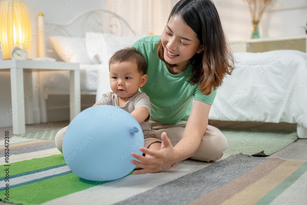 Fototapeta premium Asian baby and woman doing lifestyle activities together at home.