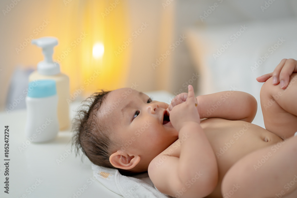 Asian baby taking a bath at home Asian baby taking a bath at home