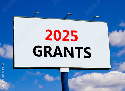 Planning 2025 grants new year symbol. Concept words 2025 Grants on beautiful big white billboard. Beautiful blue sky and clouds background. Business 2025 grants new year concept. Copy space.