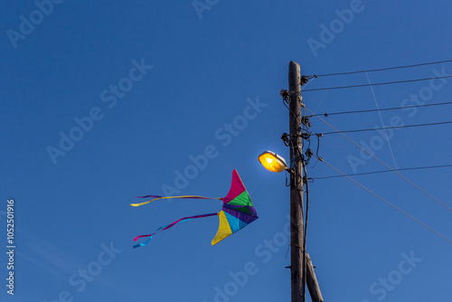 Kite stocks on the post with streetlight 