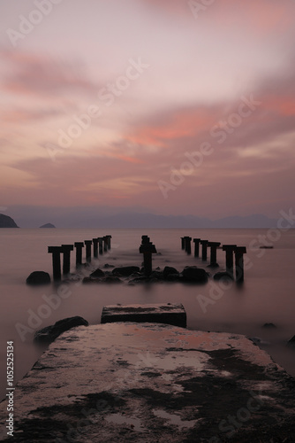 Fototapeta Naklejka Na Ścianę i Meble -  sunset on the beach. Seaside town of Turgutreis and spectacular sunsets. Selective Focus. Long Exposure shoot. tranquility scene.
