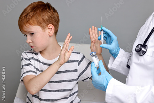 Dental phobia. Scared boy making stop gesture near dentist with syringe and vial on grey background photo