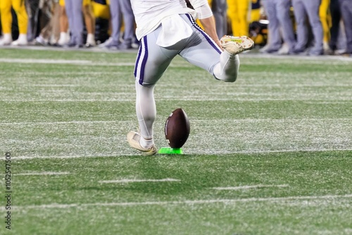 Close-up of a College football kicker on the football field