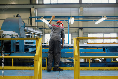 An employee of the enterprise is at the workplace and monitors the operation of the equipment