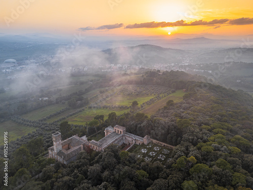 Italy, October 27, 2024: aerial view of the Villa Imperiale of Pesaro at sunset immersed in the natural park of San Bartolo with light fog. The context is poetic and dreamy