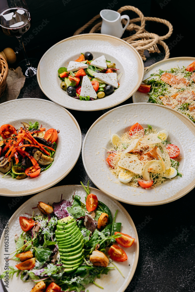 Assorted gourmet salads with ingredients like avocado, smoked salmon, feta and grilled vegetables Assorted gourmet salads with ingredients like avocado, smoked salmon, feta and grilled vegetables