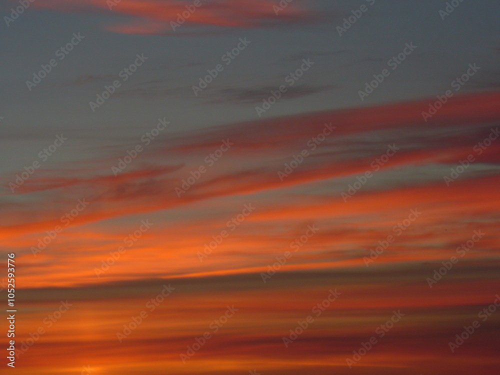 Fototapeta premium Colorful dark sky with red clouds before sunrise on autumn morning - natural background. Topics: season, weather, meteorology, atmosphere, air space, morning, season